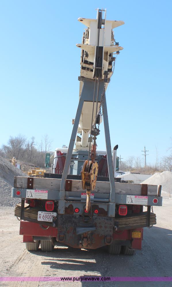 image for item H6004 2001 Volvo WG64 flatbed truck with Terex boom