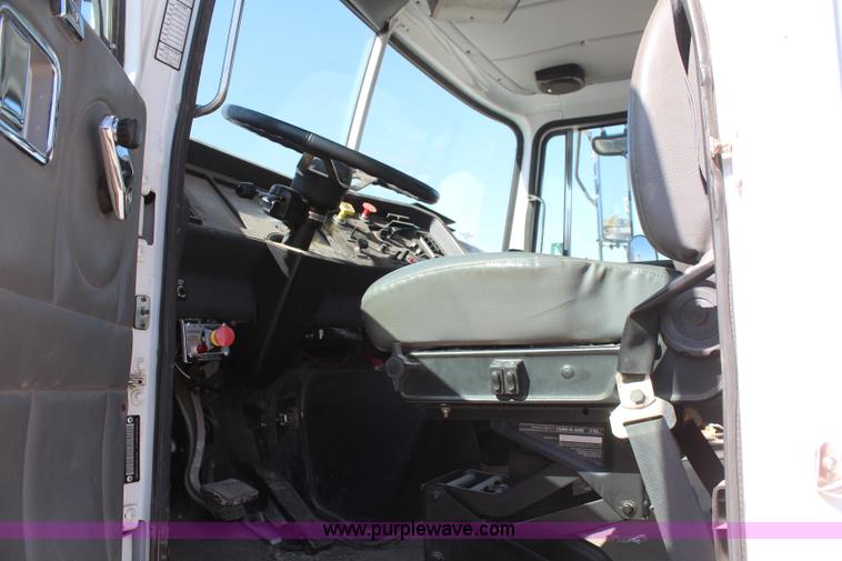 image for item H6004 2001 Volvo WG64 flatbed truck with Terex boom