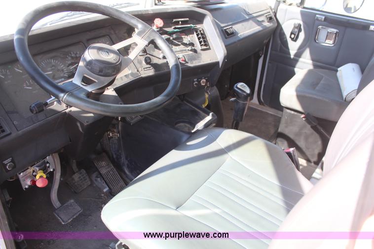 image for item H6004 2001 Volvo WG64 flatbed truck with Terex boom