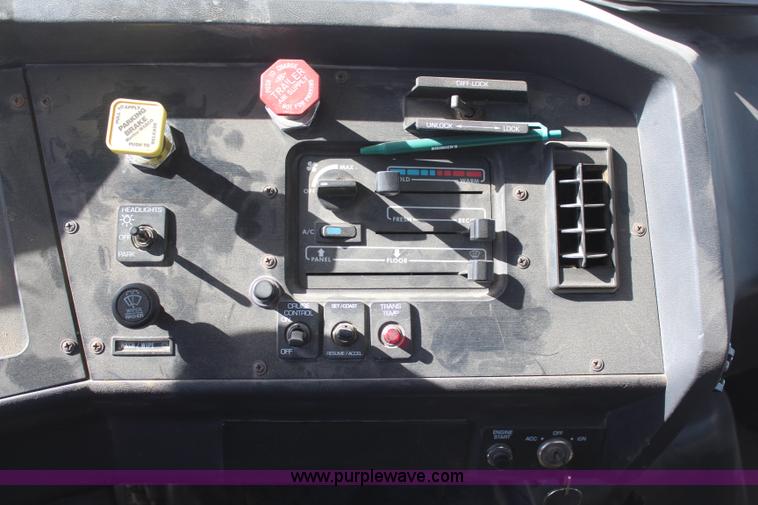 image for item H6004 2001 Volvo WG64 flatbed truck with Terex boom