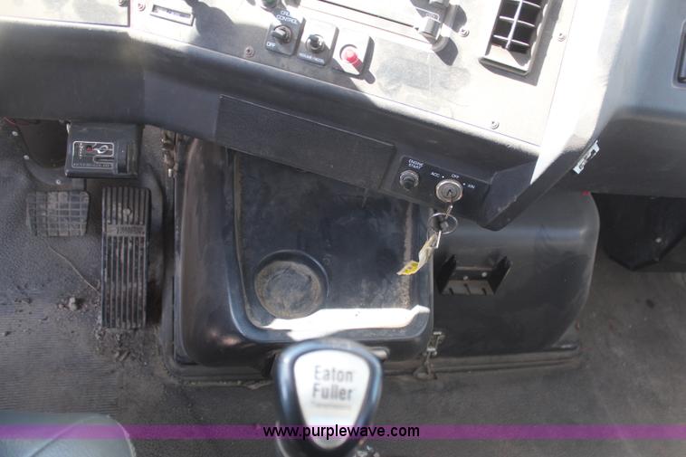 image for item H6004 2001 Volvo WG64 flatbed truck with Terex boom