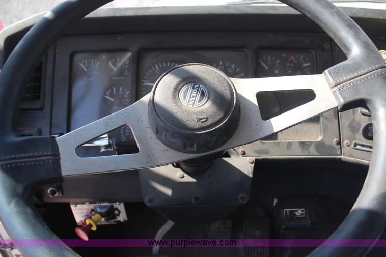 image for item H6004 2001 Volvo WG64 flatbed truck with Terex boom