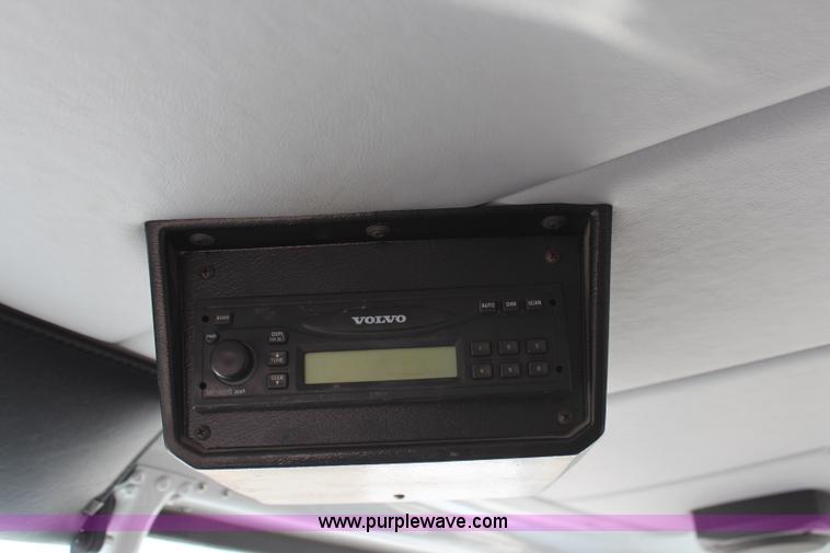 image for item H6004 2001 Volvo WG64 flatbed truck with Terex boom