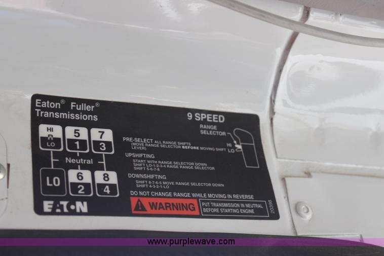 image for item H6004 2001 Volvo WG64 flatbed truck with Terex boom