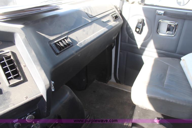 image for item H6004 2001 Volvo WG64 flatbed truck with Terex boom