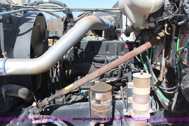 image for item H6004 2001 Volvo WG64 flatbed truck with Terex boom