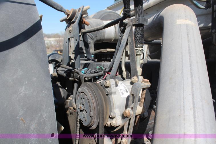 image for item H6004 2001 Volvo WG64 flatbed truck with Terex boom