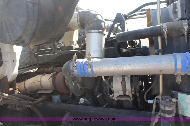 image for item H6004 2001 Volvo WG64 flatbed truck with Terex boom