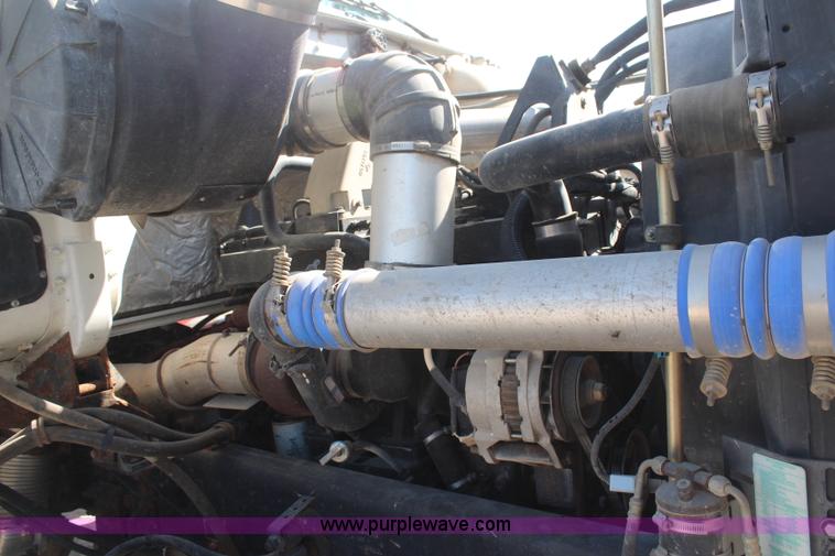 image for item H6004 2001 Volvo WG64 flatbed truck with Terex boom