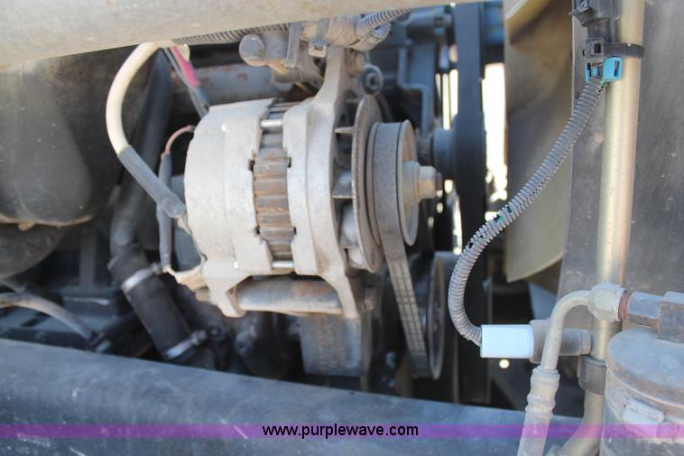 image for item H6004 2001 Volvo WG64 flatbed truck with Terex boom