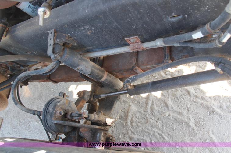 image for item H6004 2001 Volvo WG64 flatbed truck with Terex boom