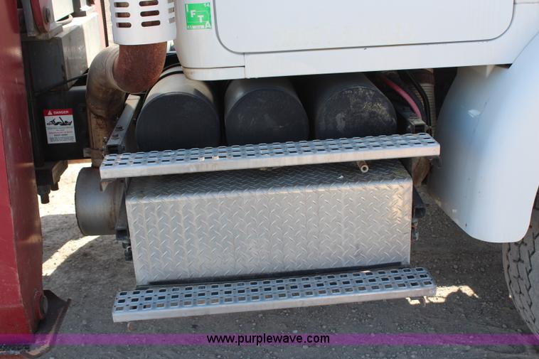 image for item H6004 2001 Volvo WG64 flatbed truck with Terex boom