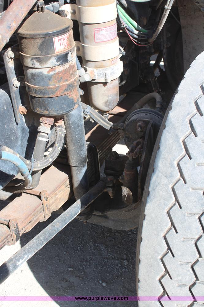 image for item H6004 2001 Volvo WG64 flatbed truck with Terex boom