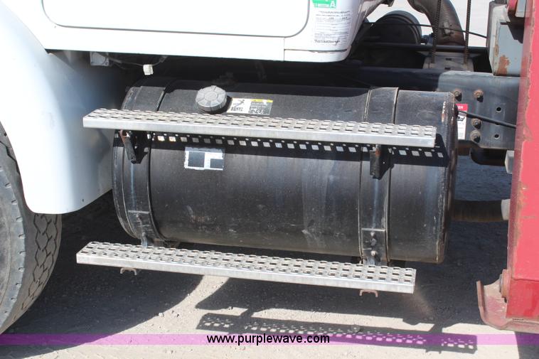 image for item H6004 2001 Volvo WG64 flatbed truck with Terex boom