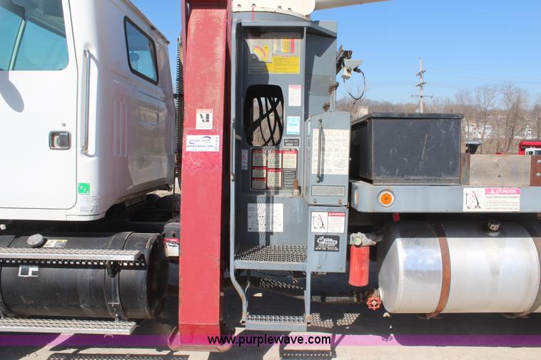 image for item H6004 2001 Volvo WG64 flatbed truck with Terex boom