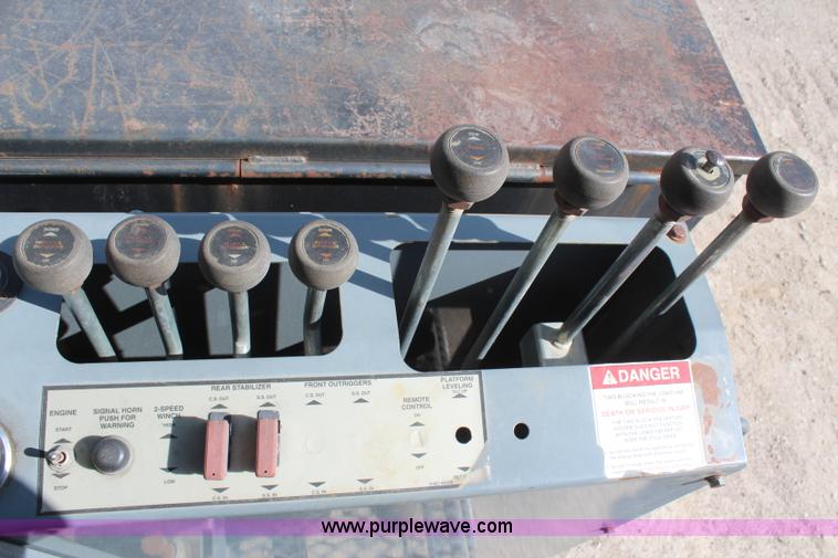 image for item H6004 2001 Volvo WG64 flatbed truck with Terex boom