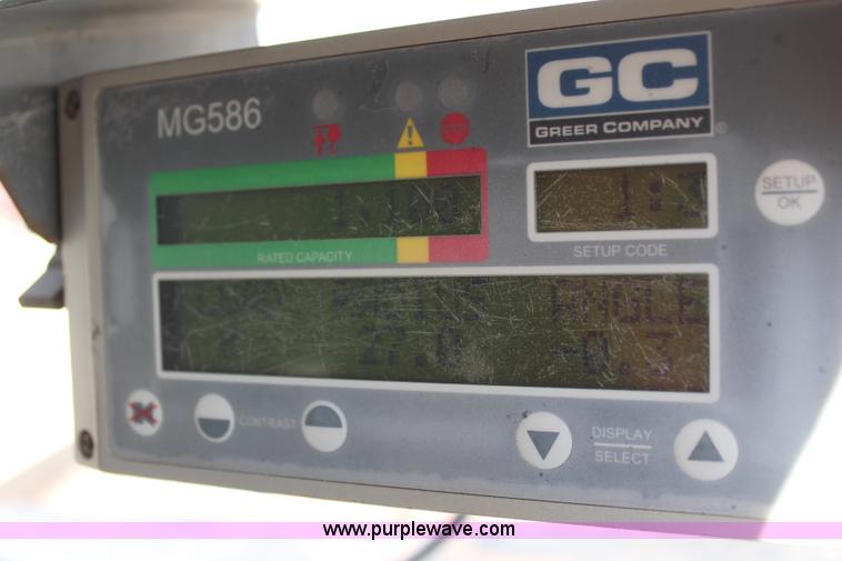 image for item H6004 2001 Volvo WG64 flatbed truck with Terex boom