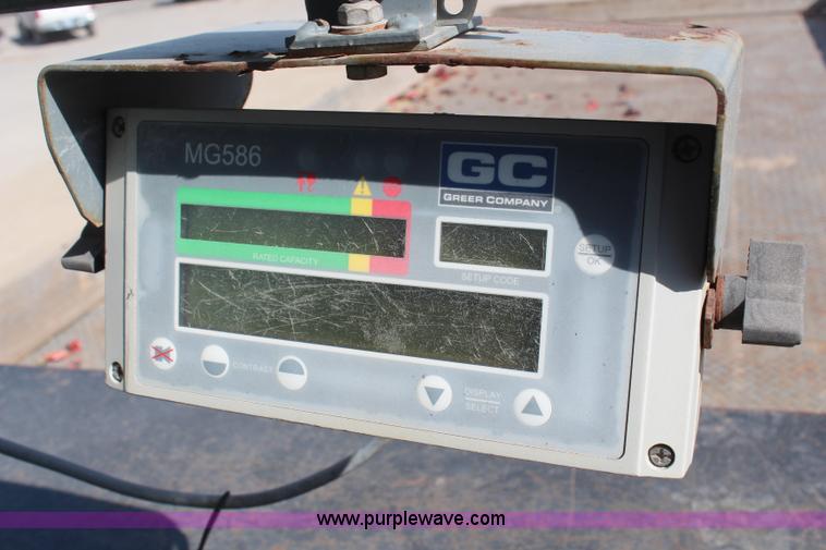 image for item H6004 2001 Volvo WG64 flatbed truck with Terex boom