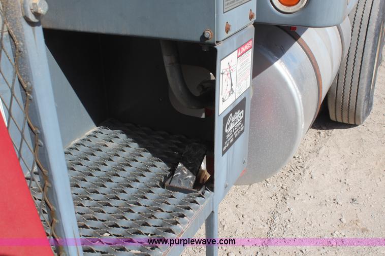 image for item H6004 2001 Volvo WG64 flatbed truck with Terex boom