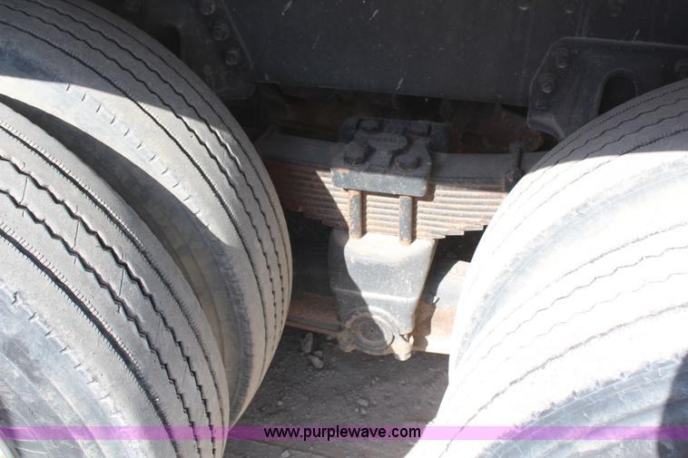 image for item H6004 2001 Volvo WG64 flatbed truck with Terex boom