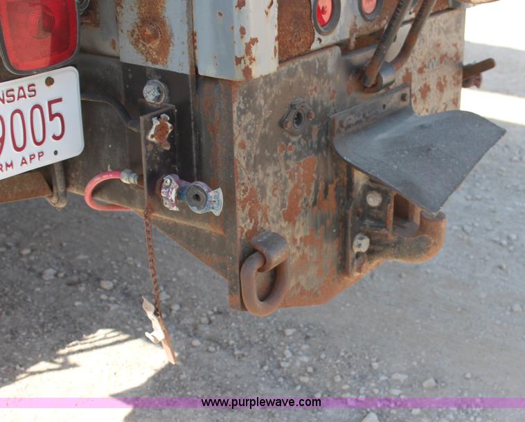 image for item H6004 2001 Volvo WG64 flatbed truck with Terex boom