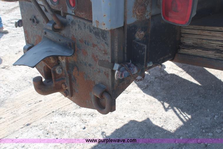 image for item H6004 2001 Volvo WG64 flatbed truck with Terex boom