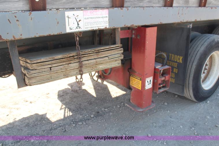 image for item H6004 2001 Volvo WG64 flatbed truck with Terex boom