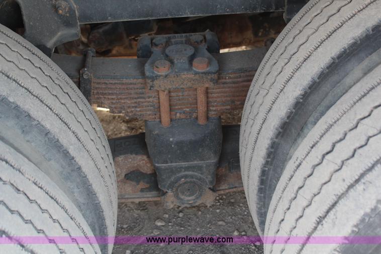 image for item H6004 2001 Volvo WG64 flatbed truck with Terex boom