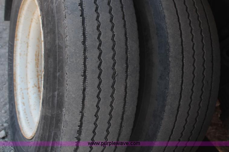 image for item H6004 2001 Volvo WG64 flatbed truck with Terex boom