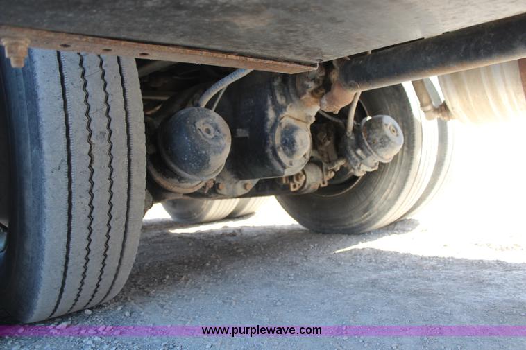 image for item H6004 2001 Volvo WG64 flatbed truck with Terex boom