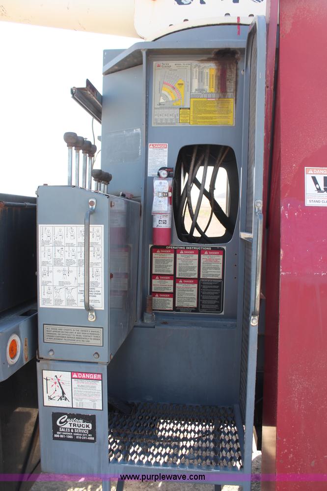 image for item H6004 2001 Volvo WG64 flatbed truck with Terex boom