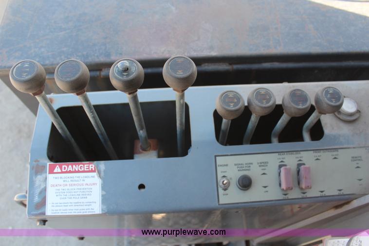 image for item H6004 2001 Volvo WG64 flatbed truck with Terex boom