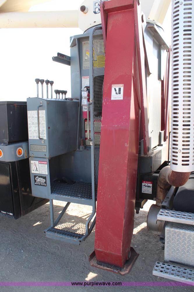 image for item H6004 2001 Volvo WG64 flatbed truck with Terex boom