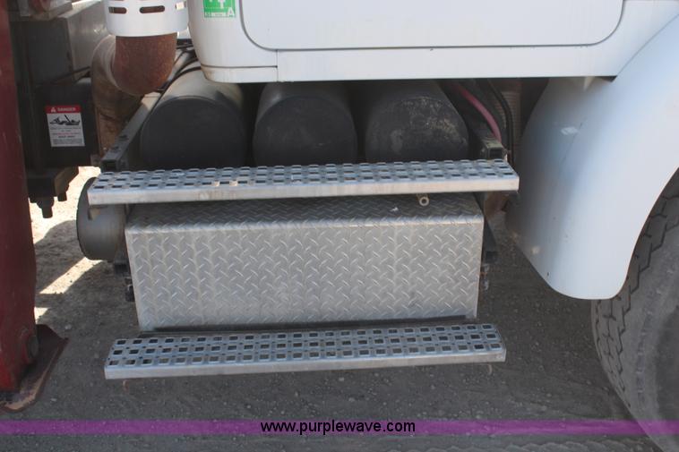 image for item H6004 2001 Volvo WG64 flatbed truck with Terex boom