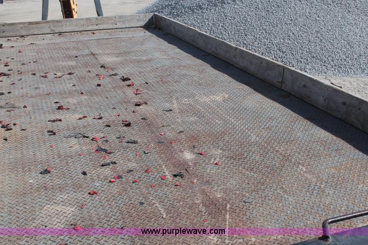 image for item H6004 2001 Volvo WG64 flatbed truck with Terex boom