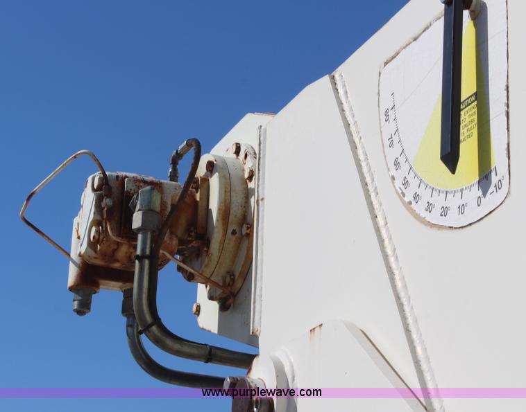 image for item H6004 2001 Volvo WG64 flatbed truck with Terex boom