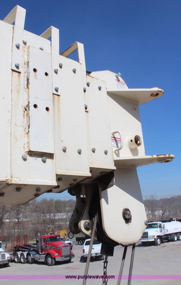 image for item H6004 2001 Volvo WG64 flatbed truck with Terex boom