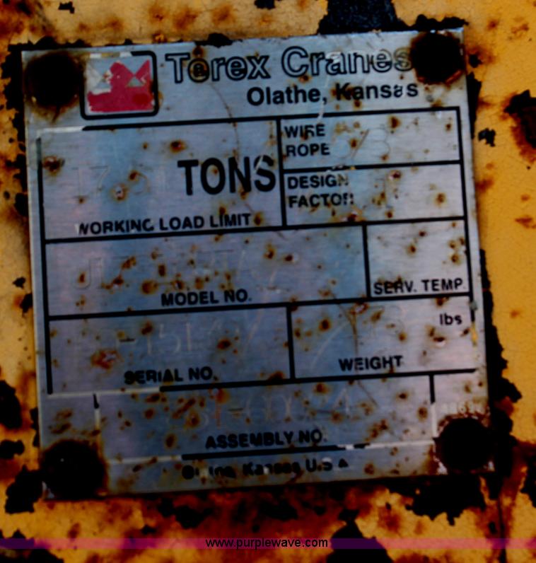 image for item H6004 2001 Volvo WG64 flatbed truck with Terex boom