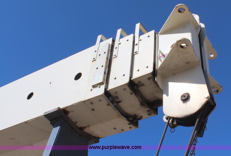 image for item H6004 2001 Volvo WG64 flatbed truck with Terex boom