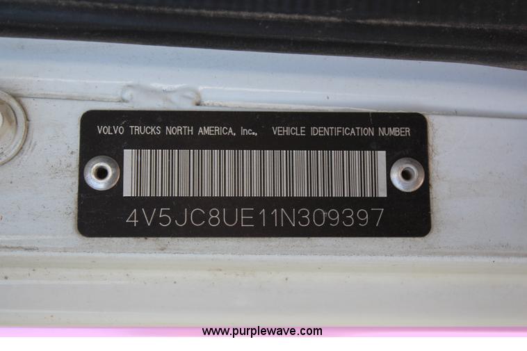 image for item H6004 2001 Volvo WG64 flatbed truck with Terex boom