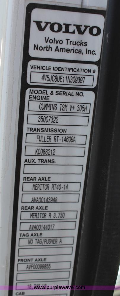 image for item H6004 2001 Volvo WG64 flatbed truck with Terex boom