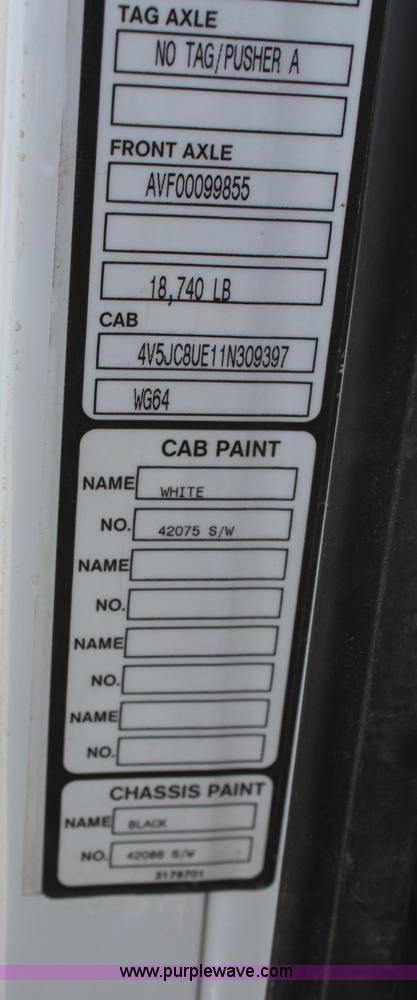 image for item H6004 2001 Volvo WG64 flatbed truck with Terex boom