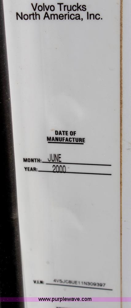 image for item H6004 2001 Volvo WG64 flatbed truck with Terex boom