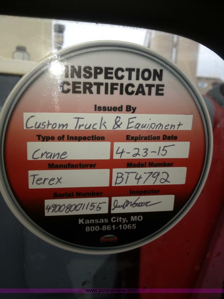 image for item H6004 2001 Volvo WG64 flatbed truck with Terex boom