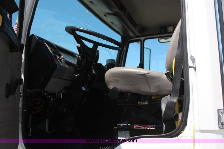 image for item H6088 2003 Freightliner FL80 flatbed truck with knuckle boom crane