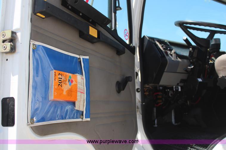 image for item H6088 2003 Freightliner FL80 flatbed truck with knuckle boom crane