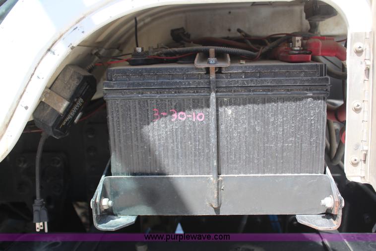 image for item H6088 2003 Freightliner FL80 flatbed truck with knuckle boom crane