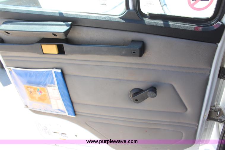 image for item H6088 2003 Freightliner FL80 flatbed truck with knuckle boom crane