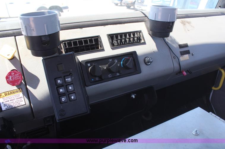 image for item H6088 2003 Freightliner FL80 flatbed truck with knuckle boom crane