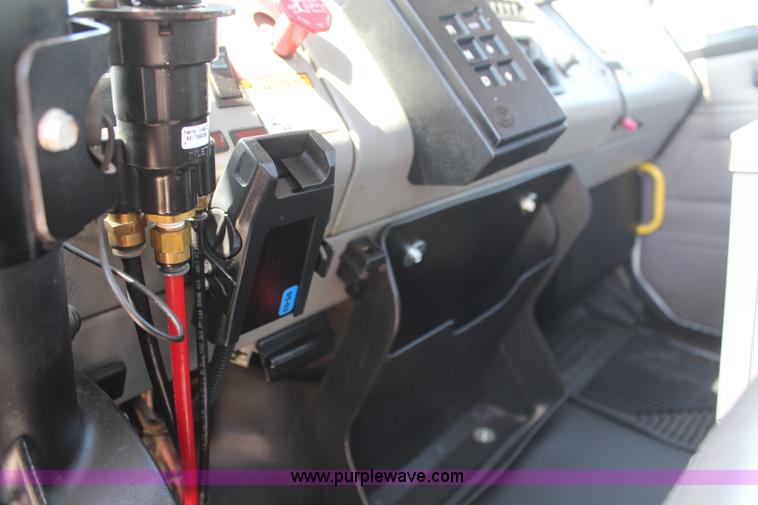 image for item H6088 2003 Freightliner FL80 flatbed truck with knuckle boom crane